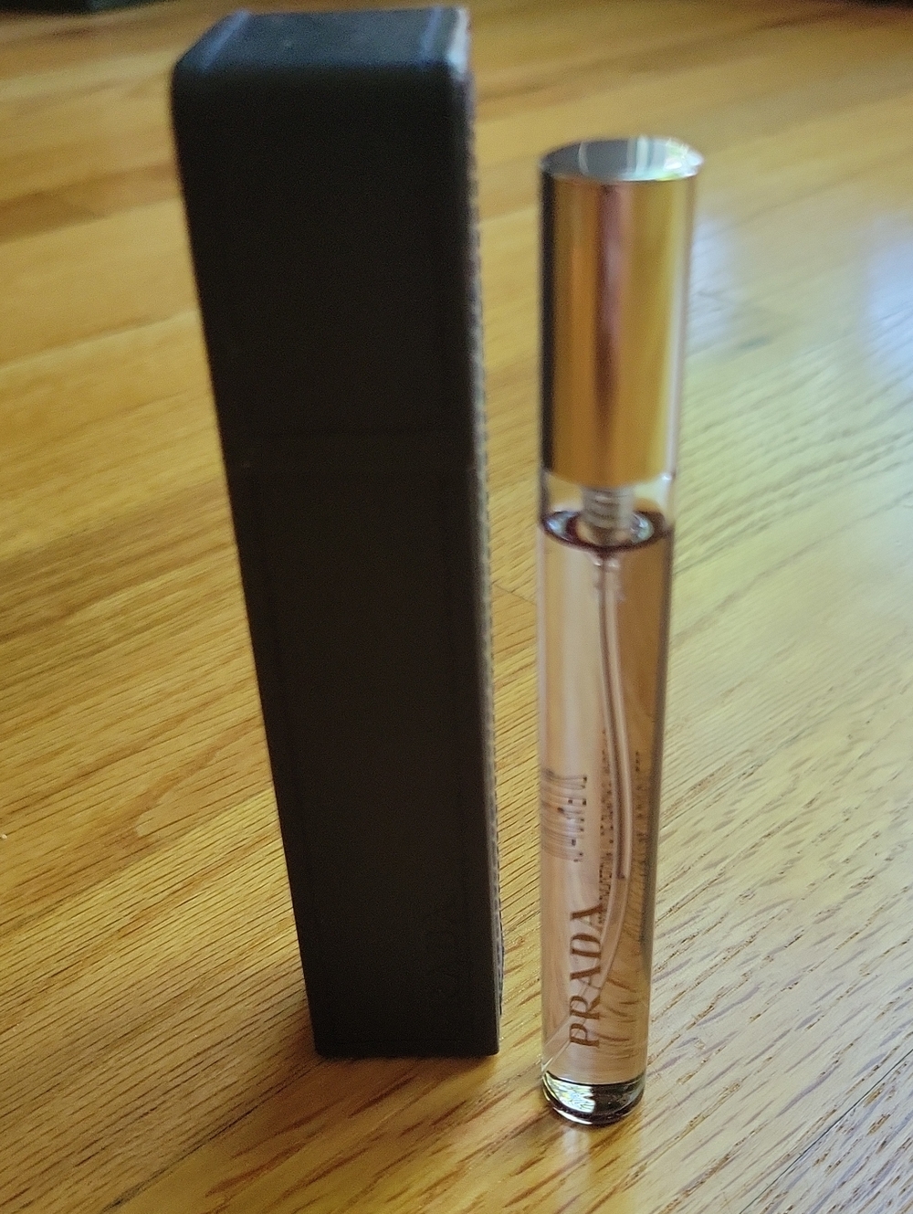 Prada Rollerball Perfume — Amber Liquid with Gold Cap and Black Sleeve - Picture 2 of 2
